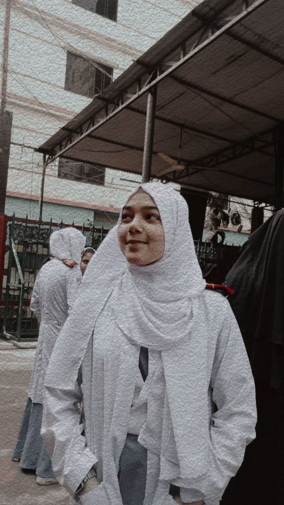 Shifa in a white hijab
